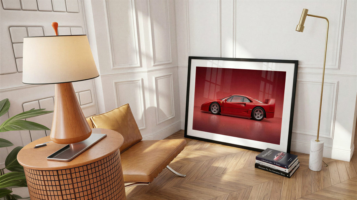 f40 rosso, black frame, beside a brass lamp