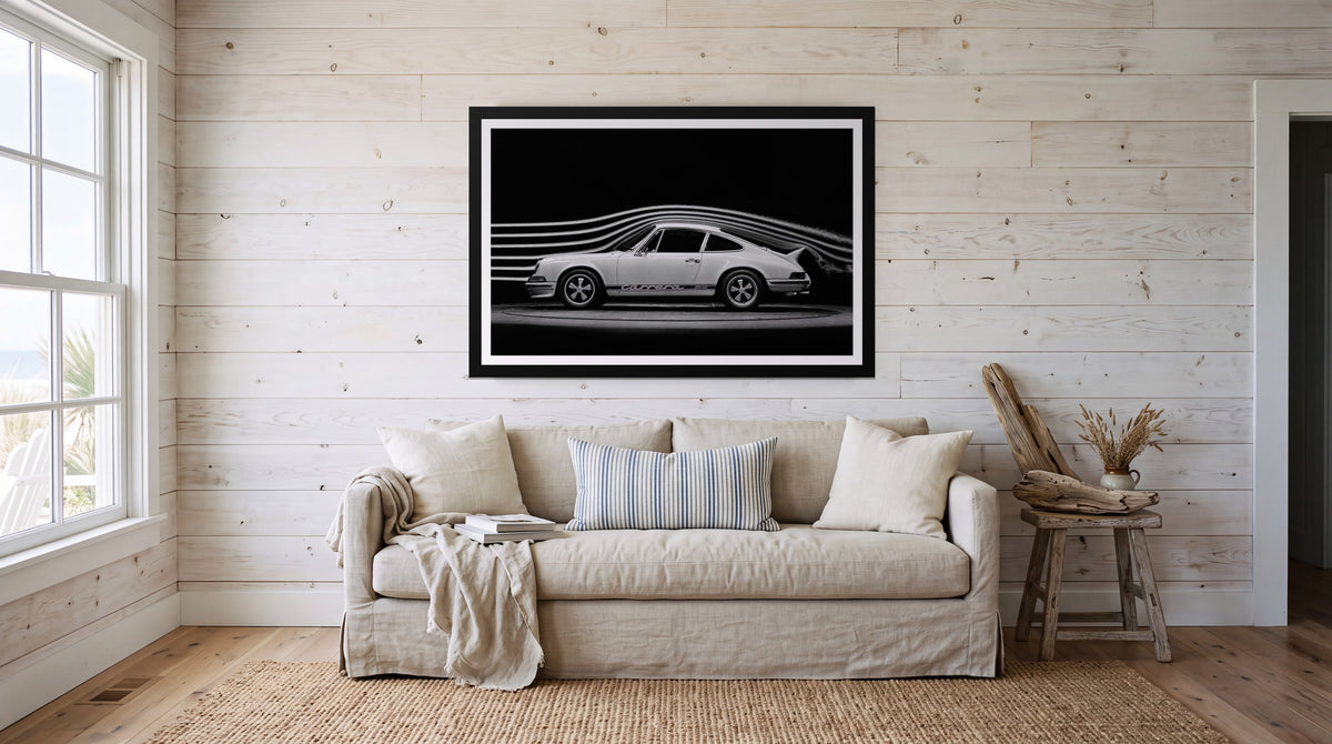 Airflow, framed in black with a white mat on a wall at home