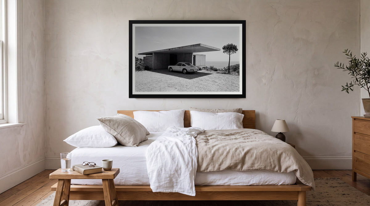 Cantilever, framed in black with a white mat on a wall at home