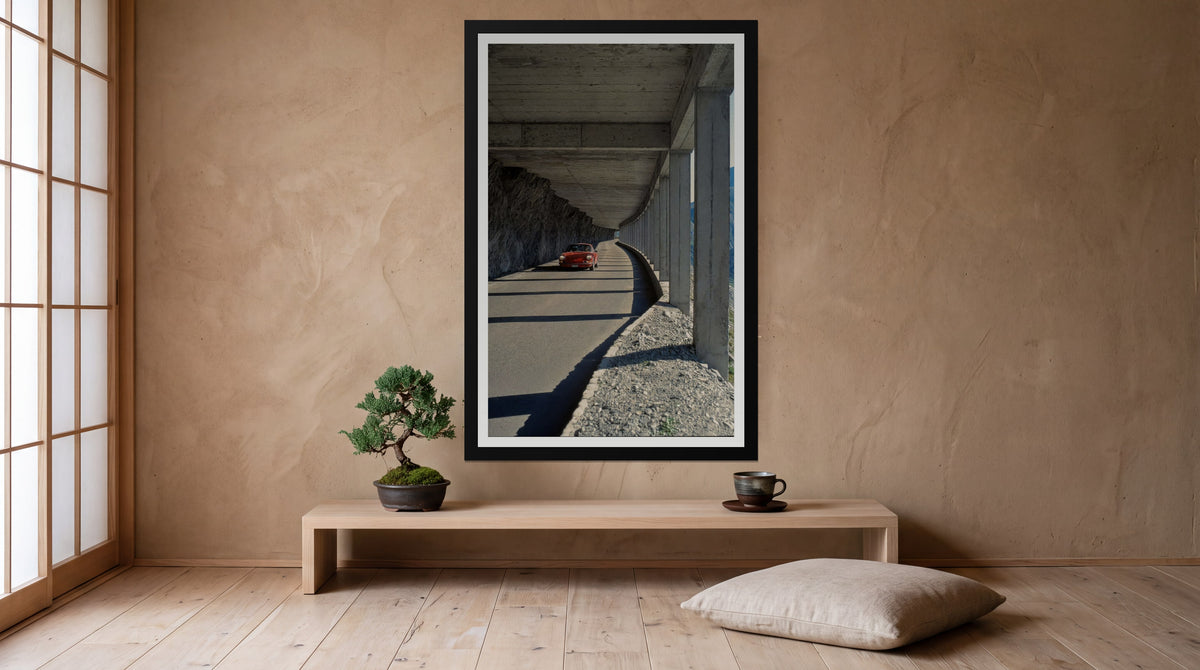 Gallery, framed in black with a white mat on a wall at home