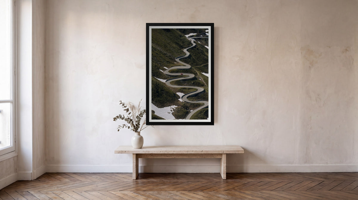 Hairpin, framed in black with a white mat on a wall at home