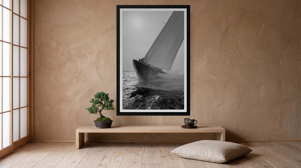 Heel, framed in black with a white mat on a wall at home
