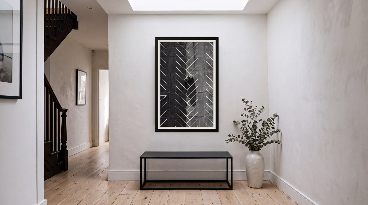 Herringbone, framed in black with a white mat on a wall at home