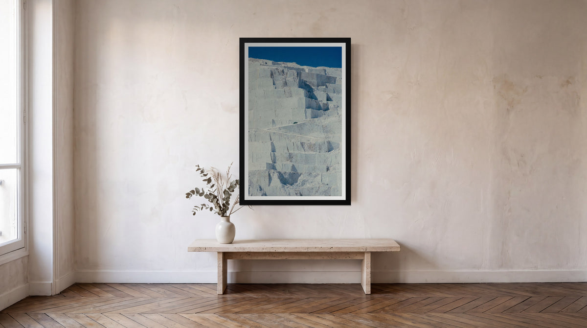 Marble, framed in black with a white mat on a wall at home