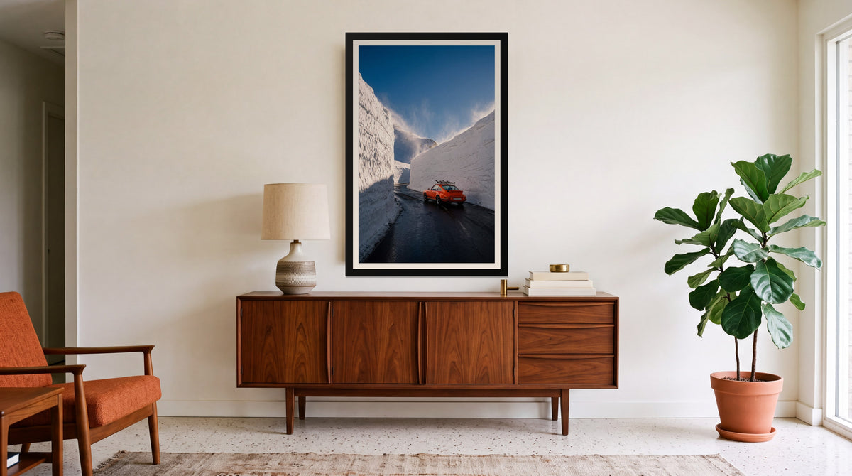 Opening Day, framed in black with a white mat on a wall at home
