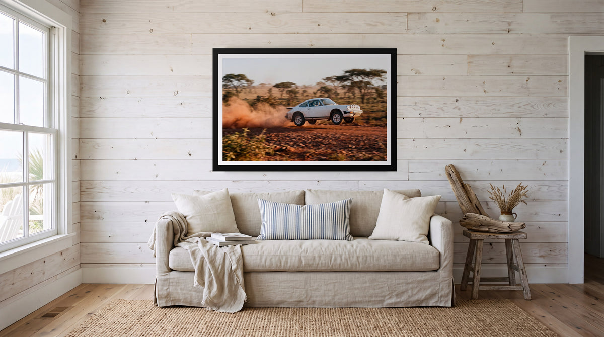 Safari, framed in black with a white mat on a wall at home