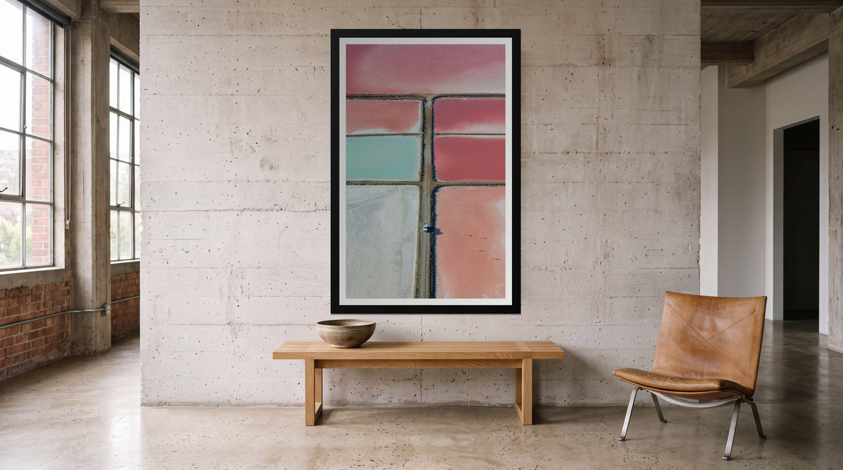 Salt Pans, framed in black with a white mat on a wall at home