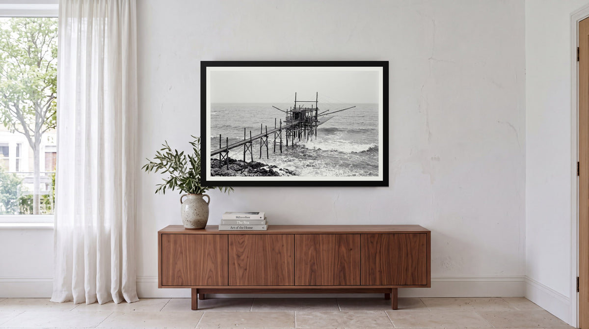 Trabocco, framed in black with a white mat on a wall at home
